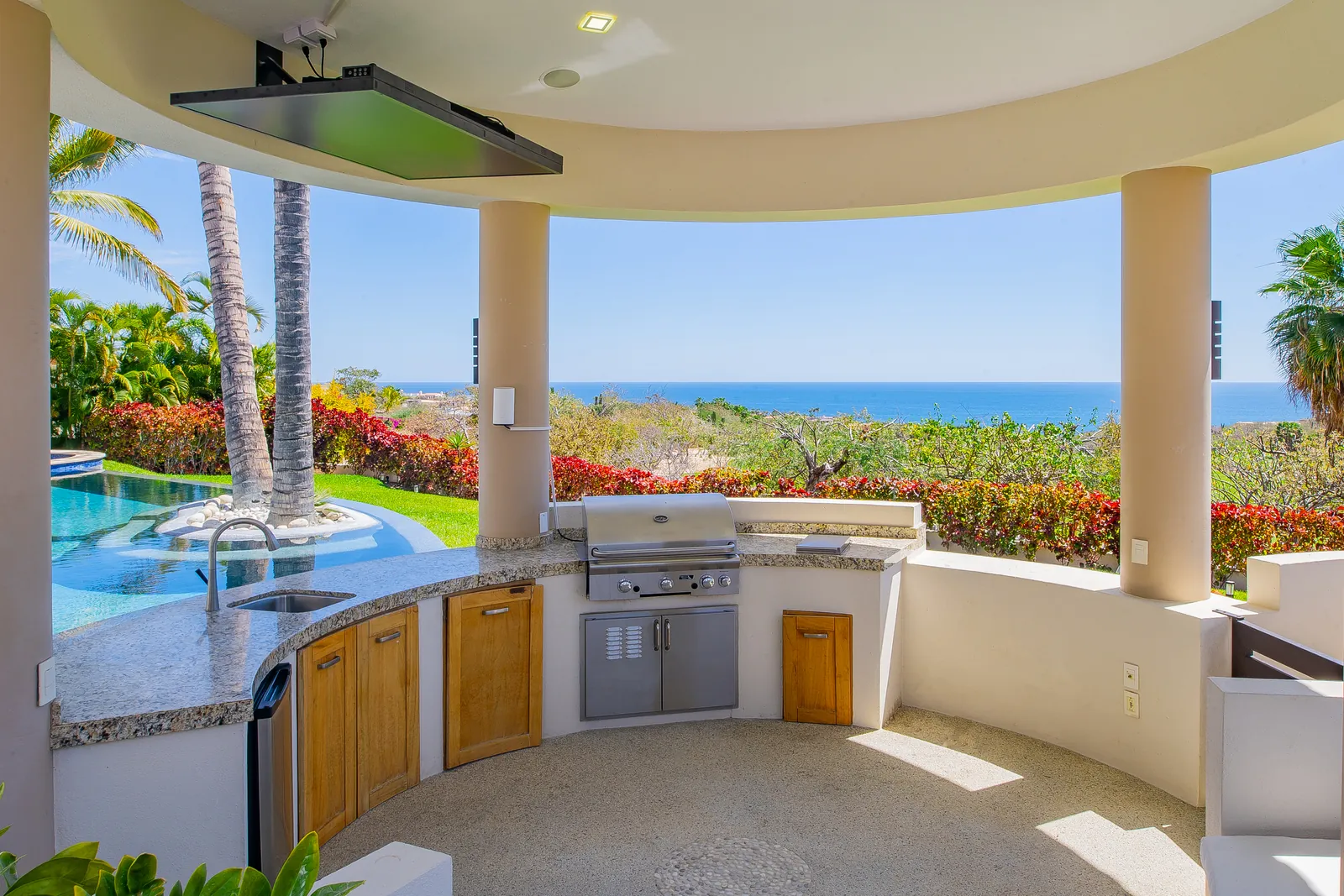 Outdoor kitchen under the palapa with ocean view