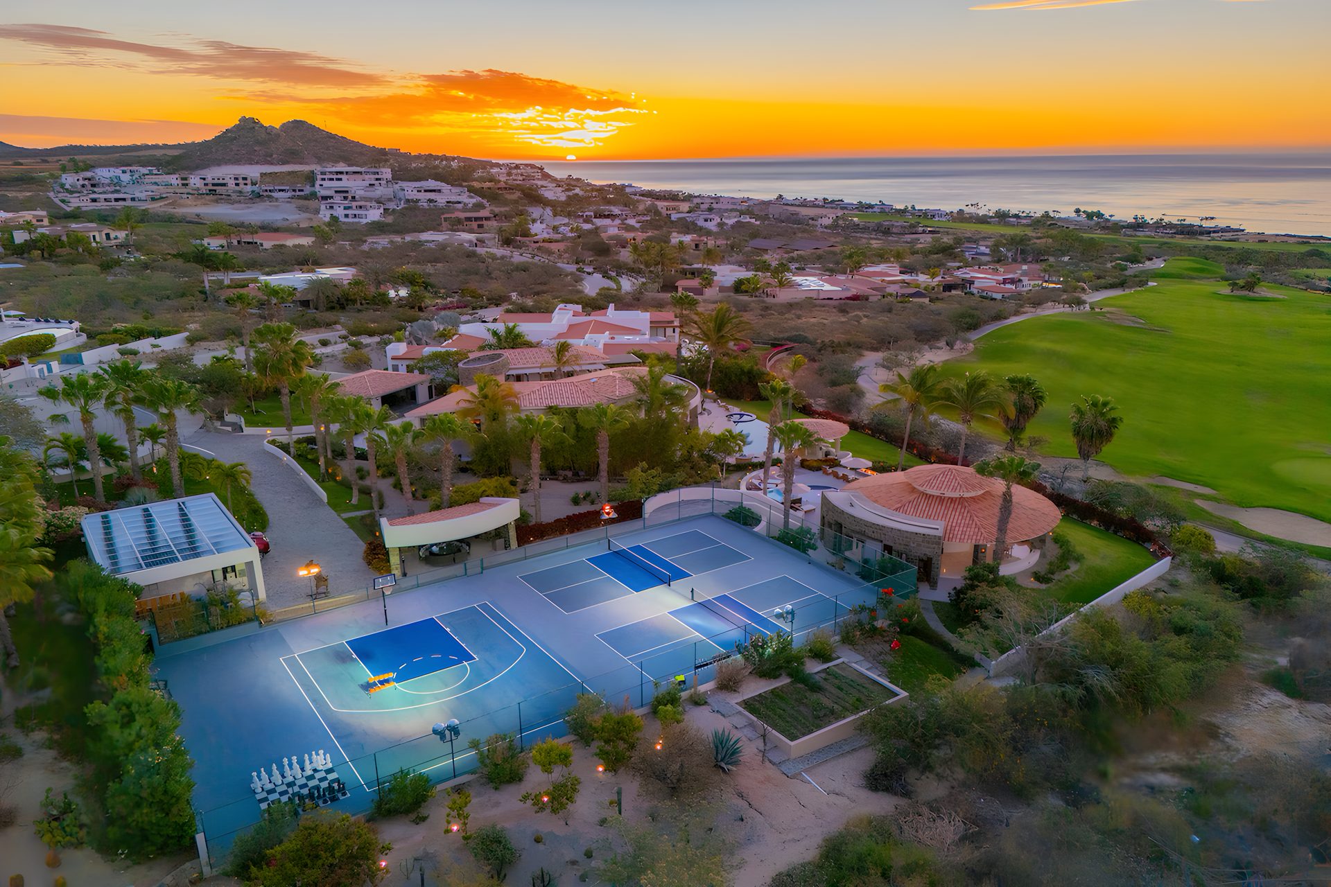 Casa Kokomo at sunset — aerial over the property toward the Sea of Cortez